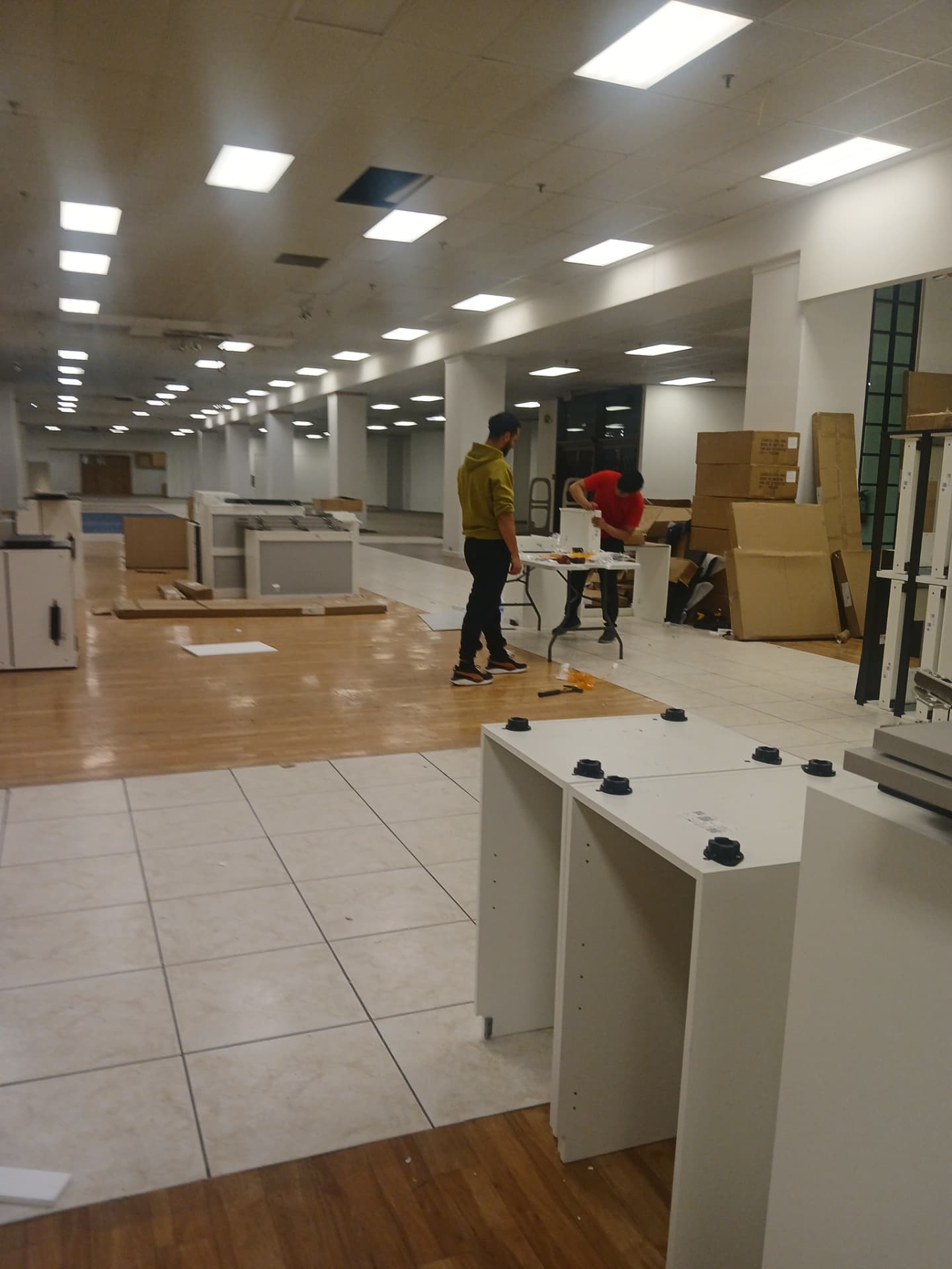 Cabinet assembly underway in a commercial interior